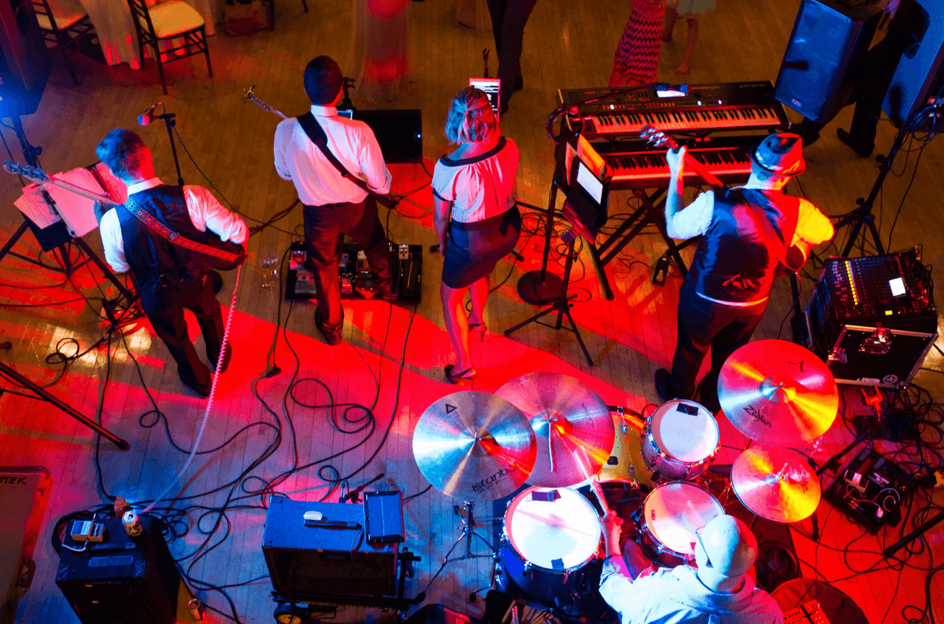 Party of 5 performing for a packed dance floor in Chicago